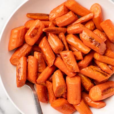 close up overhead shot of a bowl of honey roasted carrots