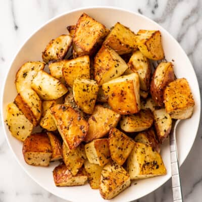 Italian roasted potatoes in a serving bowl.