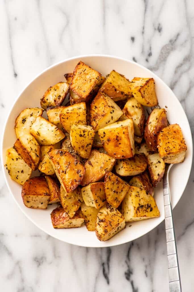 Roasted potatoes in a serving bowl.