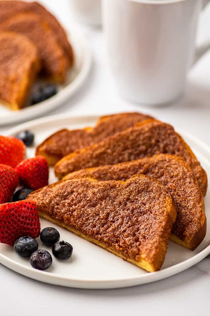 Cinnamon sugar toast on a plate with fruit.