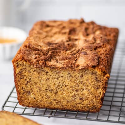 Loaf of Dominique Ansel's banana bread recipe on a cutting board.
