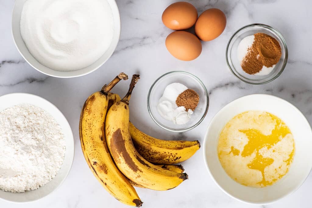 Banana bread ingredients on a counter.