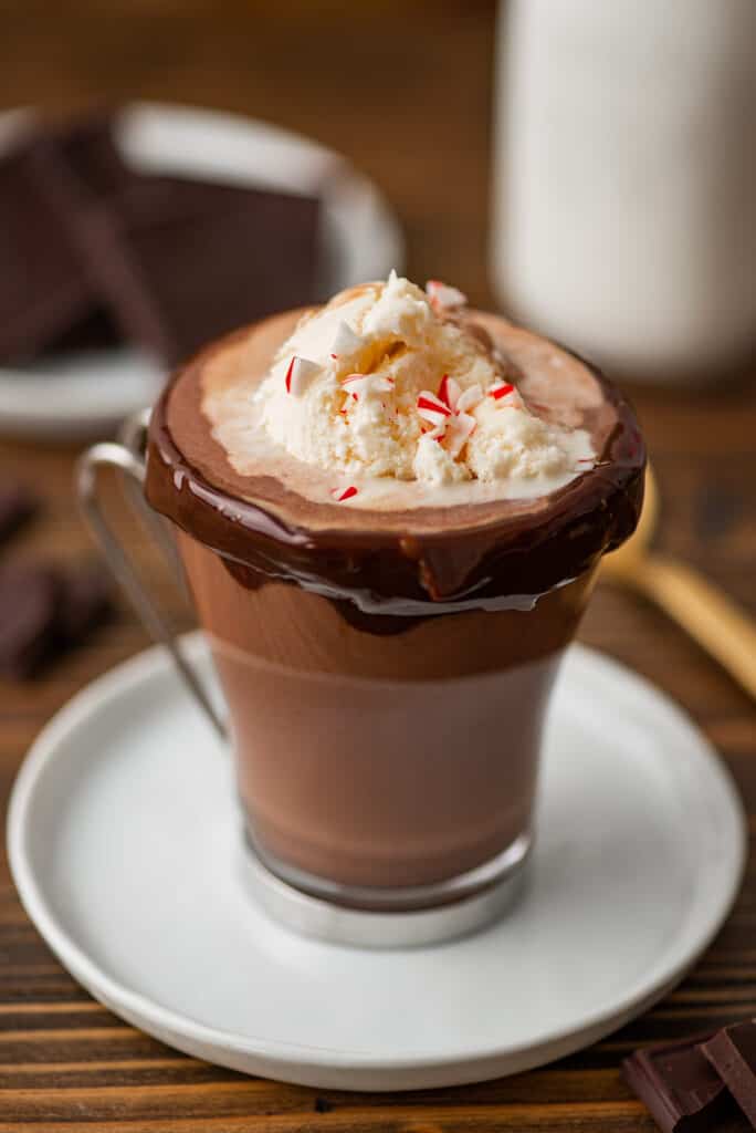 Hot chocolate float in a glass mug.