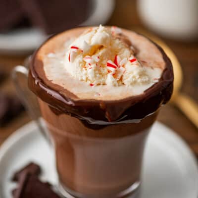 Hot chocolate float in a glass mug.
