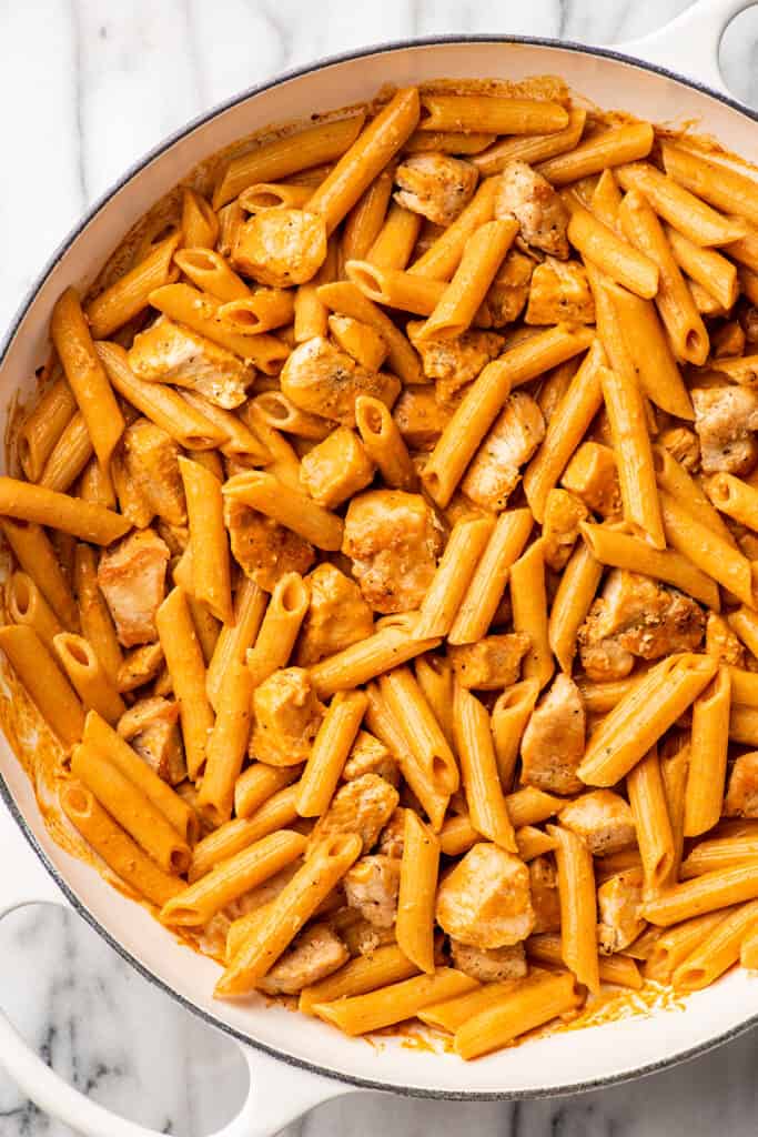 Close up photo of penne alla vodka with chicken.