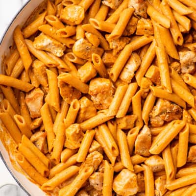 Close up photo of penne alla vodka with chicken.