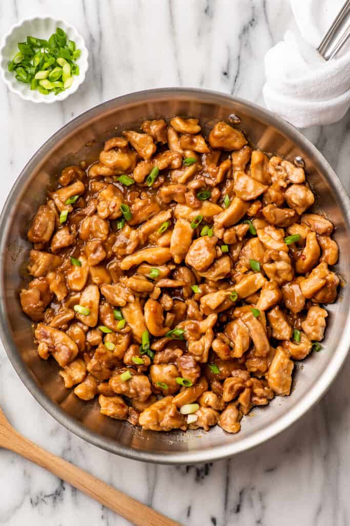 Skillet on a counter with honey ginger chicken.