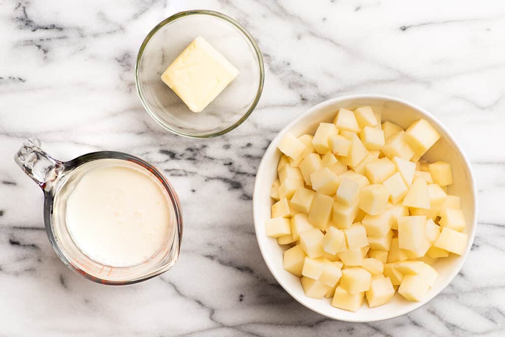 Ingredients for mashed potatoes made in the microwave on a counter.