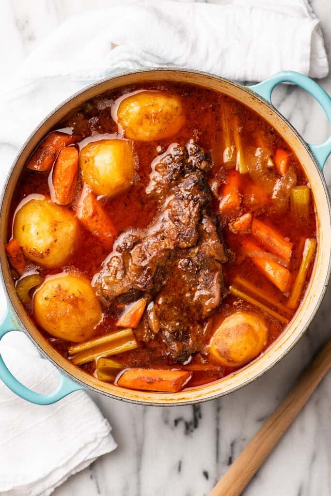 Red wine pot roast in a Dutch oven.