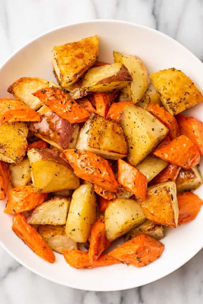 Roasted carrots and potatoes in a bowl