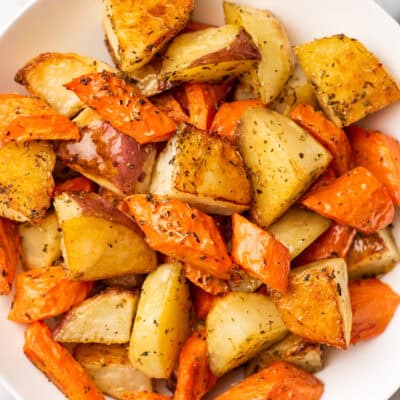 a plate of roasted carrots and potatoes