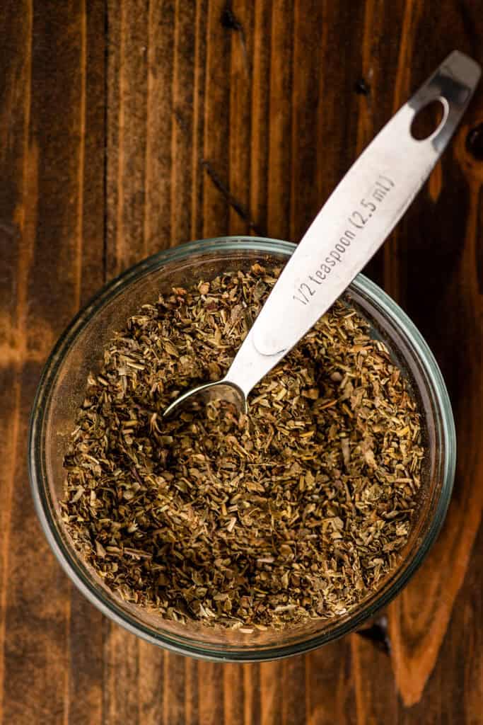 a jar of homemade seasoning with a spoon