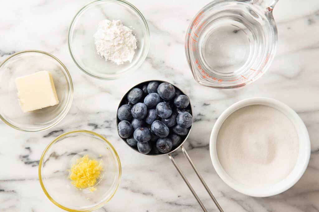 Ingredients for blueberry syrup on counter.