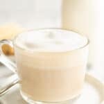 a coffee cup of london fog latte on a plate