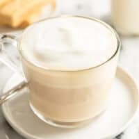 a coffee cup of london fog latte on a plate