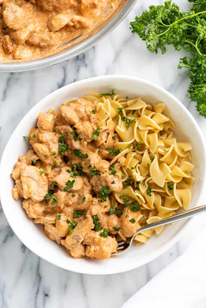 Chicken stroganoff in a bowl with parsley on top
