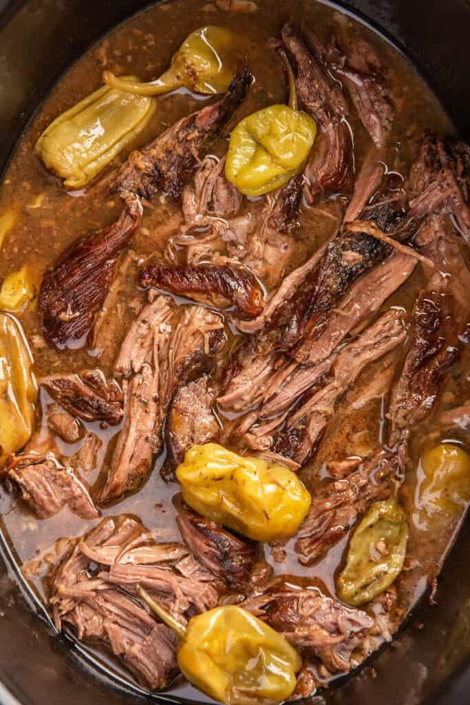 Close photo of Mississippi pot roast being made in a slow cooker
