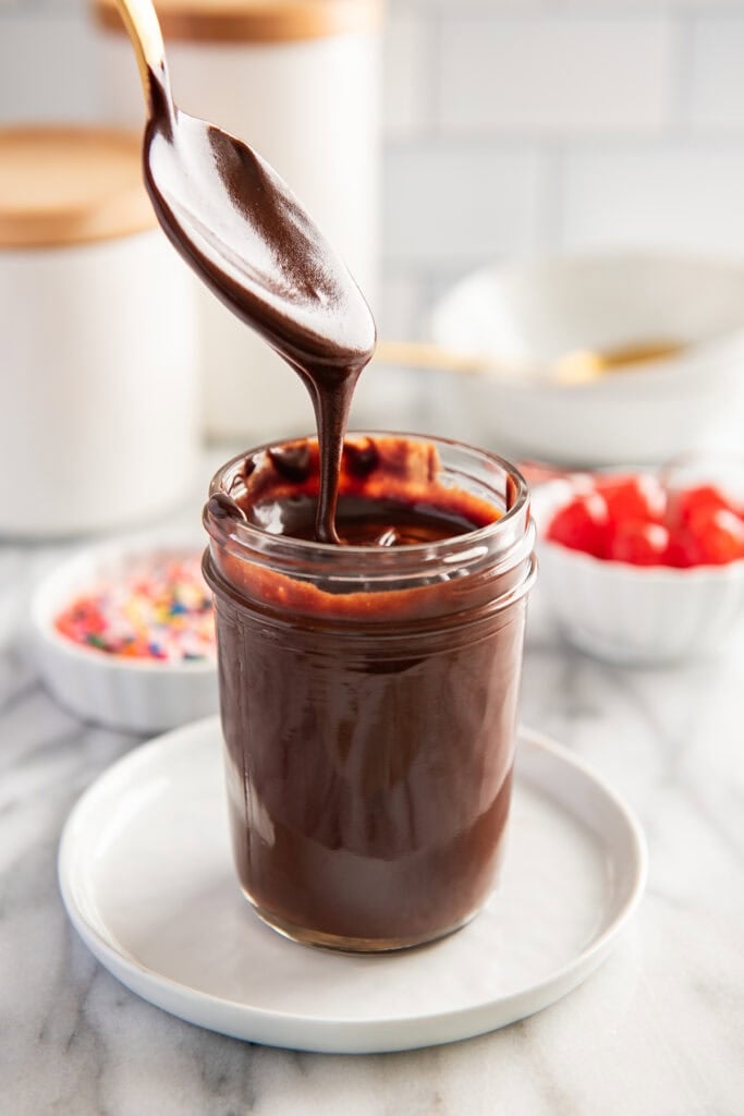 Hot fudge sauce on a spoon